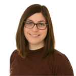 Woman with dark hair and glasses smiling at the camera.