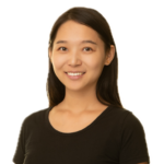 Woman with long dark hair smiling at camera