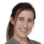 Woman with dark hair smiling at camera